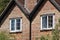 Open sash windows on a classic English country cottage house