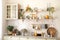Open shelves in kitchen. Stylish cuisine interior decor. Ceramic plates, dishes, utensils and cozy decor on wooden shelfs.