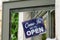 Open sign board blue hang on street shop restaurant cafe store door