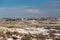 Open snow covered valley in New Mexico desert with rocky hills