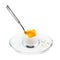 Open soft-boiled egg with spoon in glass egg cup