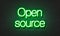 Open source neon sign on brick wall background.