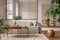 Open space interior with modular sofa, wooden coffee table, big window, beige rug, braided plaid, pillows, round table, lamp,
