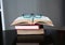 Open stack hardback books with glasses on wooden table. Education background