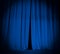 Open theater stage blue curtain with spotlight