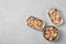 Open tin cans with tuna and cod liver on grey table, flat lay