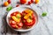 Open tomato sandwich on white plate on natural marble background. Top view, horizontal orientation