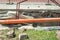 Open trench on the street excavation site with visible pipes for water gas and district heating pipeline system in the urban city