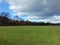 Open view of Great Lawn Central Park in autumn with one great cloud