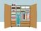 Open wardrobe. Wooden closet with tidy clothes, shirts, sweaters, boxes and shoes. Home interior