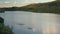 Open water swimmers with swim buoys on a calm mountain lake