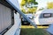 Open window of a camping trailer standing on a campsite in northern spain.