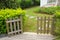 Open wooden gate and fence