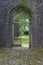 Open wooden gateway in arch of ancient priory in Brecon Beacons South Wales, UK