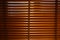 Open wooden venetian blinds. lighting range control sunlight coming from a window. decoration interior. Modern jalousie