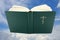 Opened bible book over sky with clipping path