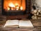 Opened book and fireplace with warm fire on the