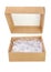 Opened brown cardboard gift box with shredded paper isolated