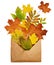 Opened craft paper envelope full of dry autumn leaves