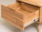 Opened drawer close view photo, wooden furniture elements background. Furniture details