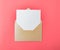 Opened gold envelope with white paper on a red background