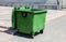 Opened green plastic recycling container