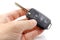 Opened ignition key with immobilizer in man`s hands