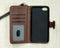 Opened leather phone case on weave background. Fashion mobile phone cover