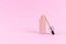 Opened liquid foundation cream with pipette unbranded bottle on a pink background. BB cream for professional make-up, eyedropper