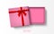 Opened pink gift box with red bow isolated on white background, vector