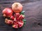 Opened ripe pomegranate fruit on wooden table. Top view