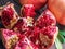 Opened ripe pomegranate fruit on wooden table. Top view