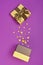 Opened shiny classic golden gift box with brown satin bow and magic confetti in the shape of stars as attributes of party