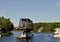 Opened swing bridge with boats passing