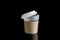 Opened take-out coffee with cup holder. Isolated on black background with Reflections