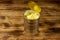 Opened tin can of pineapple pieces on wooden table