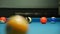 Opening Break Shot of Eight Ball Pool Game Spreading Balls Around Blue Fabric Table Surface