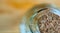 Opening of a carafe of glass closed with a cork of natural cork, cut, close-up with blurred background