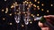 Opening champagne bottle closeup. Sparkling Wine over Holiday Bokeh Background. Slow motion