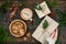 Opening Christmas present. Woman\'s hands holding decorated gift box on rustic wooden table. Ideal morning breakfast.