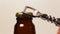 Opening cold bottle of beer with steam and spray