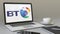 Opening laptop with BT Group logo on the screen. Modern workplace conceptual editorial 4K clip