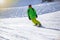 Opening of a ski resort, a young man on a snowboard on a background of mountains