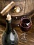 Opening of a wine bottle with corkscrew.