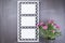 Openwork frame with 3 windows and a bouquet of roses on a dark background for mockup