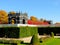 Openwork pavilions framed by bright autumn foliage