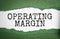 operating margin text on white torn paper