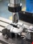 Operator machining automotive parts by machining center