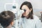 Ophthalmologist checks the boy`s vision. Vision tests in children. Hyperopia