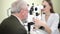 ophthalmologist examination of elderly man with slit lamp. medical equipment